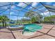 Screened-in swimming pool and spa with scenic lake views at 3336 Lakeside Cir, Parrish, FL 34219