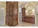 This bathroom offers beautiful granite counters, custom cabinetry, and large walk-in closet at 3814 Mira Lago Dr, Sarasota, FL 34238