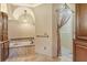 This bathroom has granite countertops, custom cabinetry, a soaking tub, and a walk-in closet at 3814 Mira Lago Dr, Sarasota, FL 34238
