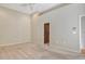 Bedroom features neutral carpet, ceiling fan, walk-in closet and ensuite bathroom at 3814 Mira Lago Dr, Sarasota, FL 34238
