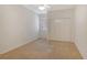 Neutral-colored bedroom with a big closet and a window overlooking the yard at 3814 Mira Lago Dr, Sarasota, FL 34238