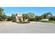 Community entrance with manicured landscaping, providing a secure and beautiful entry to Mira Lago at 3814 Mira Lago Dr, Sarasota, FL 34238