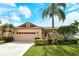Charming single-story home featuring a tile roof, manicured lawn, and a two-car garage at 3814 Mira Lago Dr, Sarasota, FL 34238