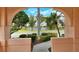 Scenic lake view framed by landscaping and home architecture at 3814 Mira Lago Dr, Sarasota, FL 34238