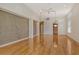Expansive living area with hardwood floors, modern ceiling fan, and decorative accent wall at 3814 Mira Lago Dr, Sarasota, FL 34238