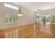 Bright and airy living room with hardwood floors and large windows at 3814 Mira Lago Dr, Sarasota, FL 34238