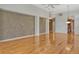 Open living area featuring wood floors, a decorative accent wall, and modern ceiling fan at 3814 Mira Lago Dr, Sarasota, FL 34238