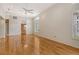 Spacious living room with wood floors, high ceilings, plantation shutters, and neutral color palette at 3814 Mira Lago Dr, Sarasota, FL 34238