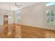 Bright, open living area featuring wood floors, plantation shutters, and neutral walls at 3814 Mira Lago Dr, Sarasota, FL 34238