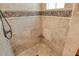 Beautifully tiled walk-in shower with a built-in corner seat in the bathroom at 3814 Mira Lago Dr, Sarasota, FL 34238