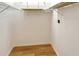 Walk-in closet featuring hardwood floors and wire shelving for optimal storage and organization at 3814 Mira Lago Dr, Sarasota, FL 34238