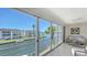 Relaxing balcony with waterfront views, comfortable seating, and bright sunlight at 4320 Falmouth Dr # 301, Longboat Key, FL 34228