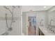 Bathroom featuring a glass shower, updated fixtures, and access to the bedroom at 4320 Falmouth Dr # 301, Longboat Key, FL 34228