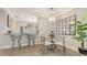 Eat-in kitchen and dining area with wood floors and modern furnishings at 4320 Falmouth Dr # 301, Longboat Key, FL 34228