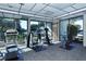 Well-lit fitness center featuring a variety of exercise equipment and large windows with pleasant views at 4320 Falmouth Dr # 301, Longboat Key, FL 34228