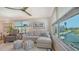 Bright living room with a comfortable couch and a scenic view of the waterfront at 4320 Falmouth Dr # 301, Longboat Key, FL 34228