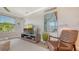 Living room featuring a modern chair, TV, and art at 4320 Falmouth Dr # 301, Longboat Key, FL 34228