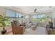 Bright living room features water views, comfortable seating and light wood flooring at 4320 Falmouth Dr # 301, Longboat Key, FL 34228