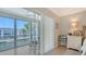 Main bedroom with outdoor access, white walls, and desk at 4320 Falmouth Dr # 301, Longboat Key, FL 34228