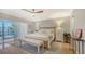 Well-lit main bedroom with large bed, white walls, and outdoor balcony access at 4320 Falmouth Dr # 301, Longboat Key, FL 34228