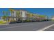 Exterior view of the covered parking area surrounded by lush landscaping at 4320 Falmouth Dr # 301, Longboat Key, FL 34228