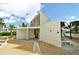 Beach restroom facility with white exterior, gravel surroundings, and benches at 4320 Falmouth Dr # 301, Longboat Key, FL 34228
