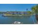 Scenic waterfront view of a multi-story condominium complex from a private balcony at 4320 Falmouth Dr # 301, Longboat Key, FL 34228