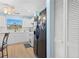 Modern kitchen featuring stainless steel appliances, white cabinets, and granite countertops at 5388 Pamela Wood Way # 8, Sarasota, FL 34233
