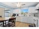Well-lit kitchen with white cabinets, white countertops, and stainless steel appliances at 5388 Pamela Wood Way # 8, Sarasota, FL 34233
