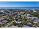 Coastal community aerial shot, showcasing lush vegetation, homes and a gorgeous ocean view at 651 Fox St, Longboat Key, FL 34228
