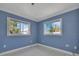 Bedroom with tile floors and large bright windows at 651 Fox St, Longboat Key, FL 34228