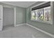 Bright bedroom with tile floors, a window, and closet at 651 Fox St, Longboat Key, FL 34228