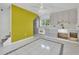 Kitchen with mosaic backsplash, gray cabinets, white appliances, and modern tiling at 651 Fox St, Longboat Key, FL 34228