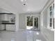 Open floor plan with kitchen featuring updated appliances and bright natural light at 651 Fox St, Longboat Key, FL 34228