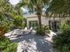 Charming outdoor patio with comfortable seating, lush greenery, and a relaxed atmosphere perfect for enjoying coffee at 651 Fox St, Longboat Key, FL 34228