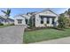 Charming home with a beautiful lawn, paver driveway, and a two car garage at 17903 Palmiste Dr, Bradenton, FL 34202