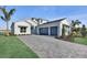 Attractive two-story home featuring a paver driveway and two car garage at 17903 Palmiste Dr, Bradenton, FL 34202