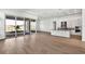 Open concept kitchen with a large island, stainless steel appliances, and access to an outdoor patio at 17903 Palmiste Dr, Bradenton, FL 34202