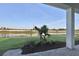 Covered patio with a view of a serene pond at 17903 Palmiste Dr, Bradenton, FL 34202