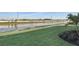 Picturesque view of a serene pond with mature palms at 17903 Palmiste Dr, Bradenton, FL 34202