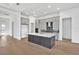 Modern open-concept kitchen with an island, stainless appliances, and ample cabinetry at 17915 Palmiste Dr, Bradenton, FL 34202