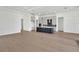Spacious open-concept kitchen features modern appliances, gray cabinetry and large center island at 17915 Palmiste Dr, Bradenton, FL 34202