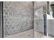 Bathroom featuring modern walk-in shower with glass door and geometric tile at 17915 Palmiste Dr, Bradenton, FL 34202