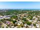 Overhead image of a neighborhood highlighting the subject home with solar panels, trees, and landscaping at 2822 Maple Ave, Sarasota, FL 34234