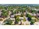 Aerial shot of a home featuring solar panels, nestled in a neighborhood with mature trees at 2822 Maple Ave, Sarasota, FL 34234