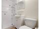 Bathroom featuring a tiled stand up shower and a white sink and toilet at 2822 Maple Ave, Sarasota, FL 34234