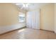Bright bedroom with tile flooring, neutral walls, and a ceiling fan at 2822 Maple Ave, Sarasota, FL 34234