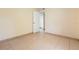 Bedroom featuring tile flooring and neutral walls with a white door at 2822 Maple Ave, Sarasota, FL 34234