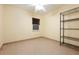 Bedroom featuring a small window, tile flooring, and metal shelving unit at 2822 Maple Ave, Sarasota, FL 34234