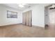 Bright bedroom with tile flooring, neutral walls, and a ceiling fan for added comfort at 2822 Maple Ave, Sarasota, FL 34234